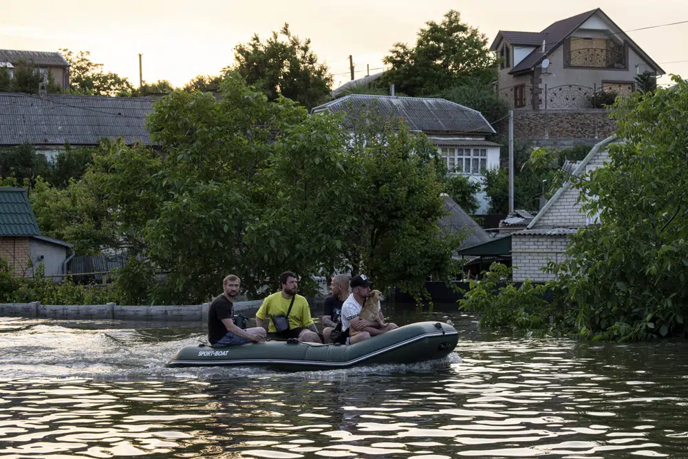Zelenskyy visits area flooded by destroyed dam