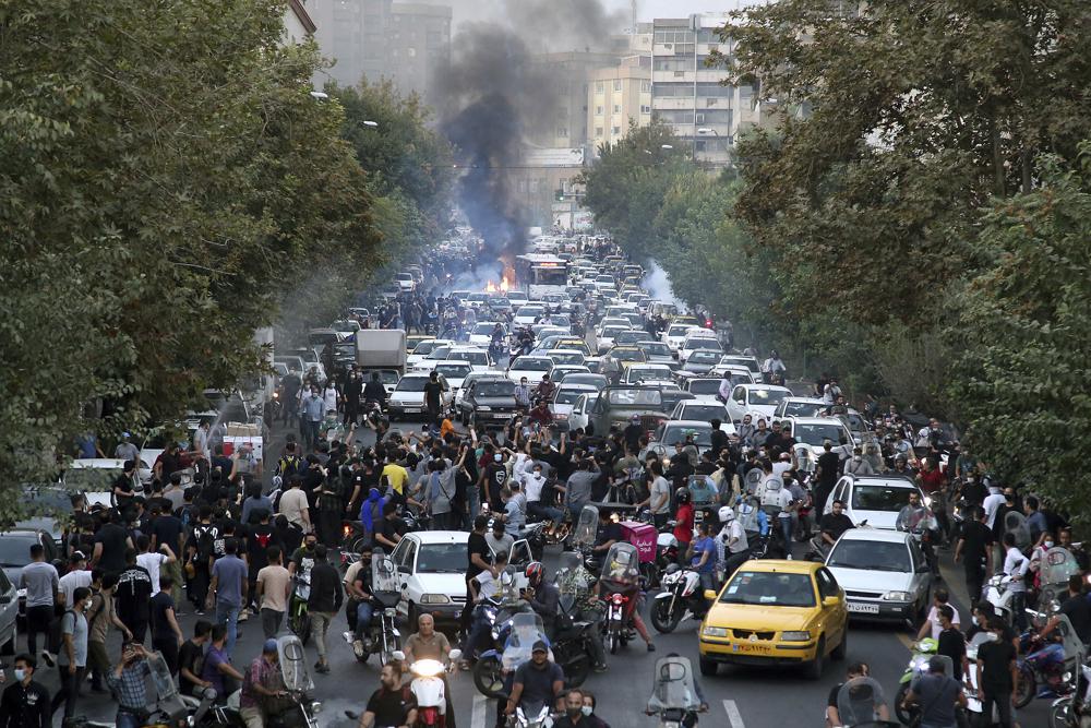 9 killed as Iran protests over woman’s death spread