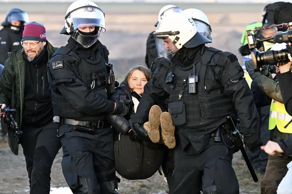 Greta Thunberg carried away by police at protest