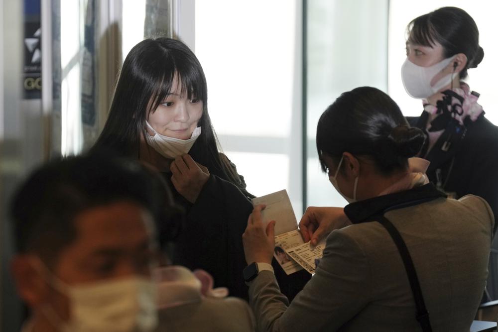 Japan’s former princess leaves for US