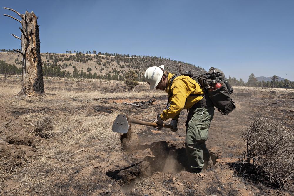 Crews try to protect more homes from fires