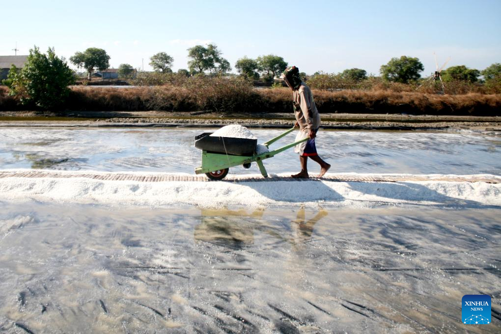 Farmers harvest salt in East Java, Indonesia