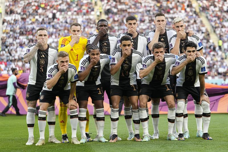 Germany players cover mouths at World Cup in FIFA protest