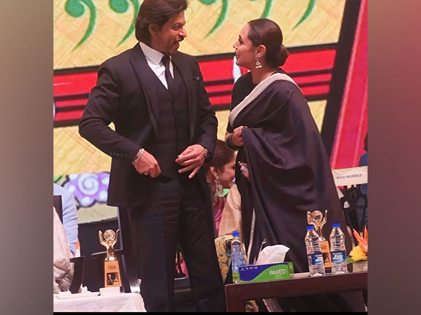 Rani Mukerji plants a kiss on SRK’s hand at KIFF