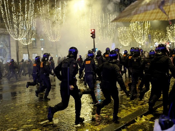 French police use tear gas against fans on Champs-Elysees