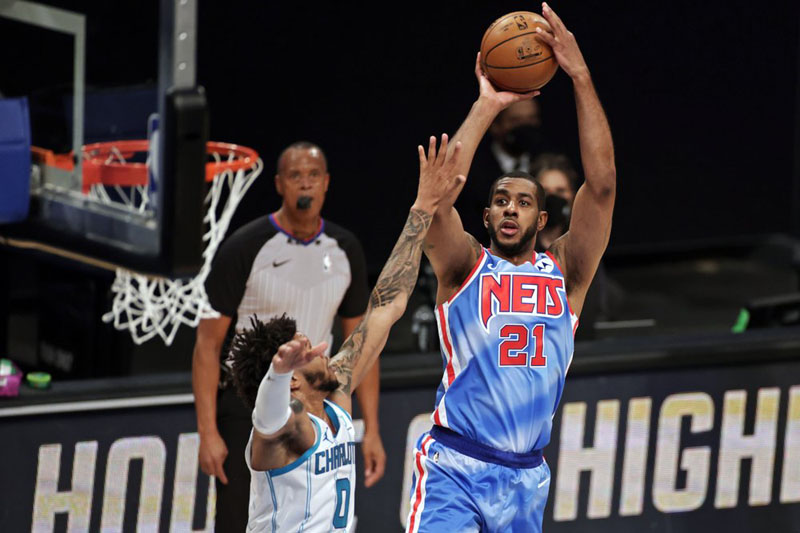 Embiid, 76ers top undermanned Nets 123-117 for 1st in East