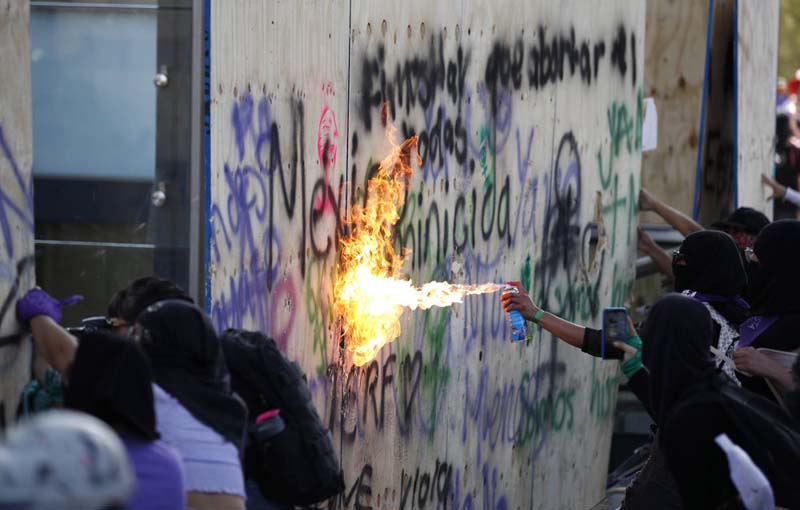 Mexican president defends record as women protest