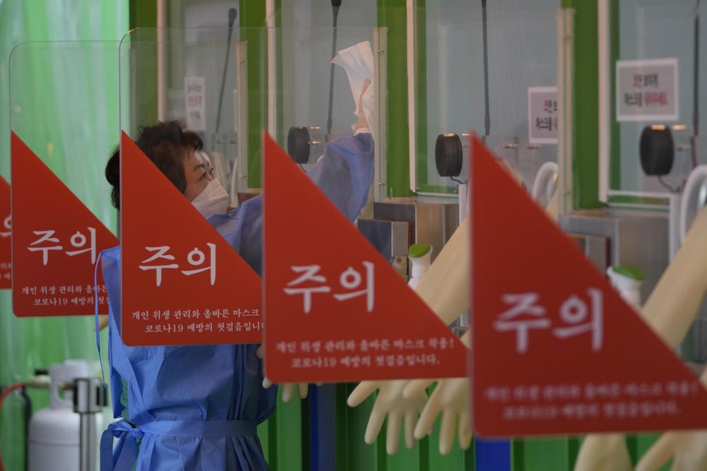 S. Korea keeps crowd limits as omicron spikes