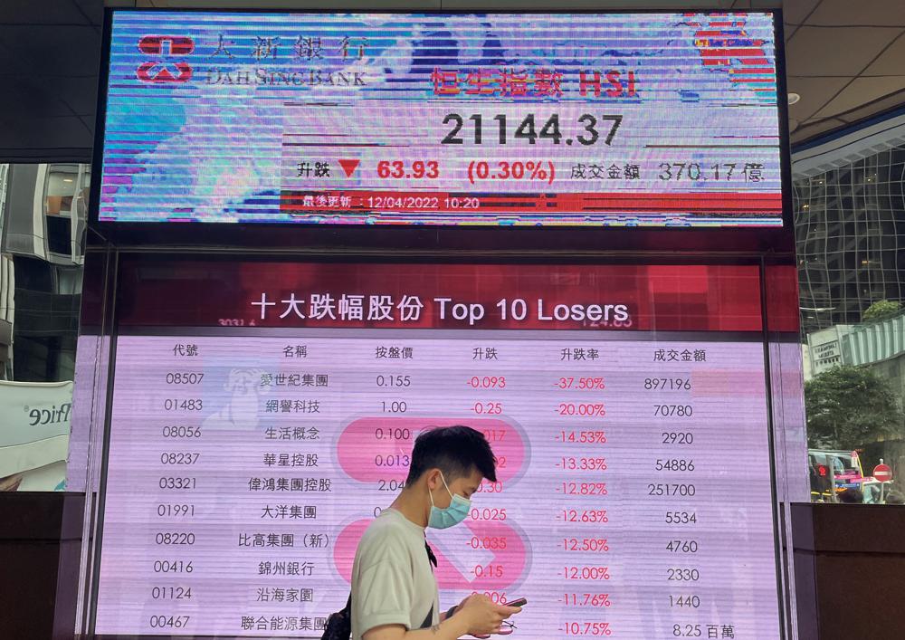 Asian stocks fall as investors await U.S. profits, inflation