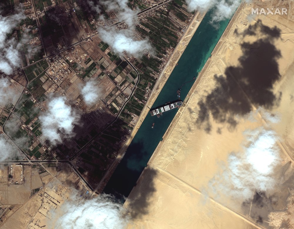 Container ship stuck in Suez Canal ‘partially refloated’