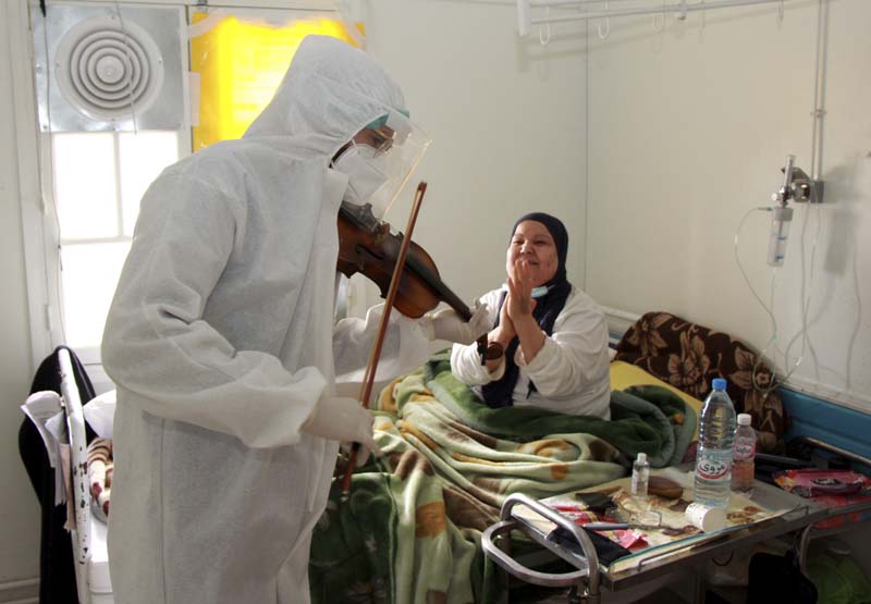 Tunisian doctor plays violin to boost virus patients’ morale