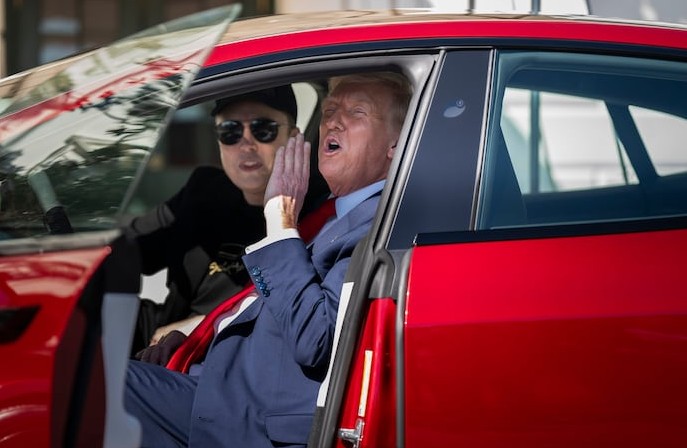 Trump buys beautiful red Tesla at White House alongside ‘patriot’ Musk