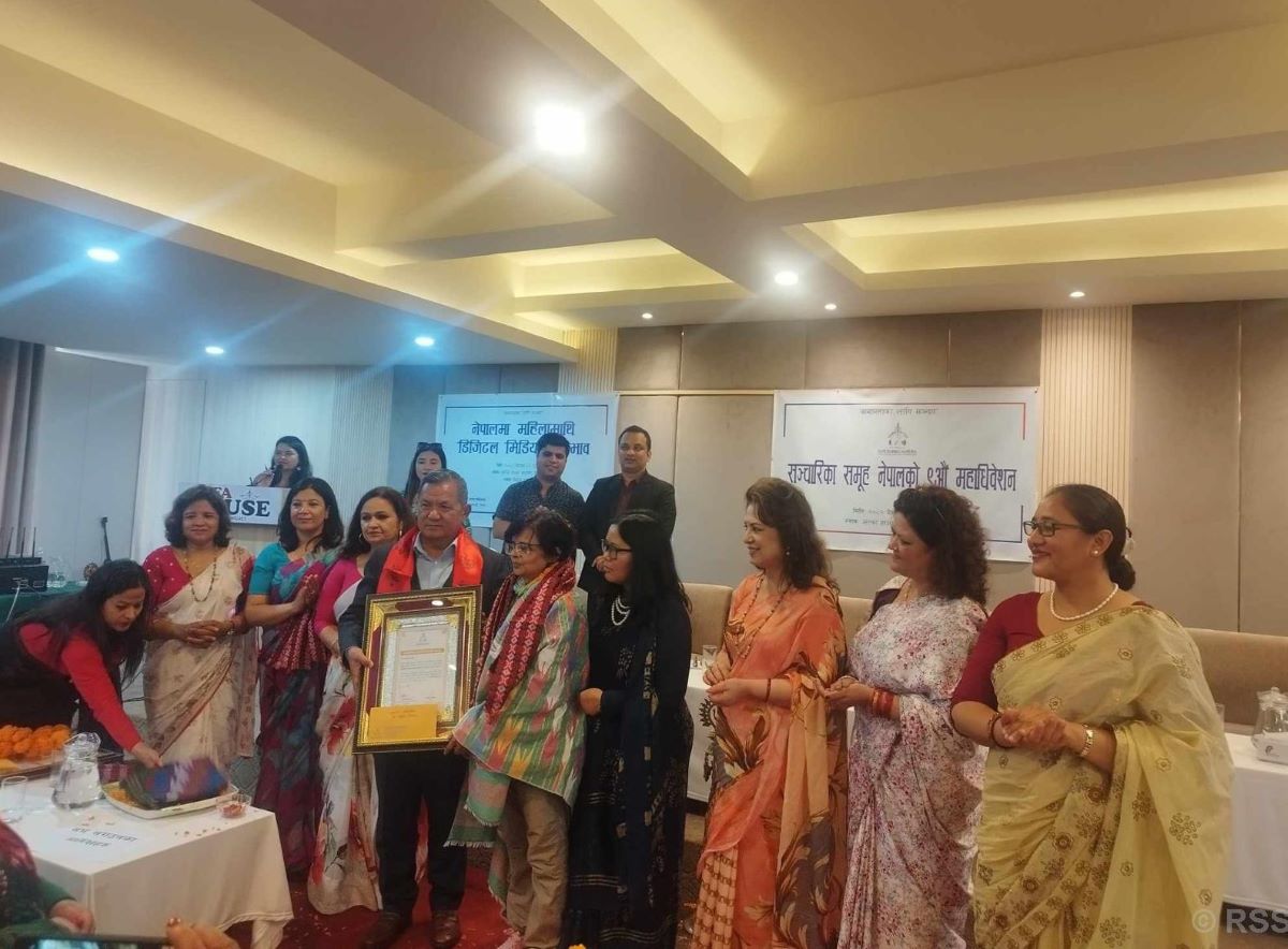 Sancharika Leading Honour presented to journalists Adhikari and Lohani