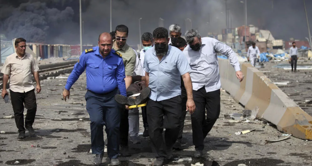 Eighteen killed, fires still burning in huge Iran port blast