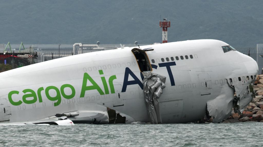 Two dead as cargo plane skids off runway at Hong Kong Airport