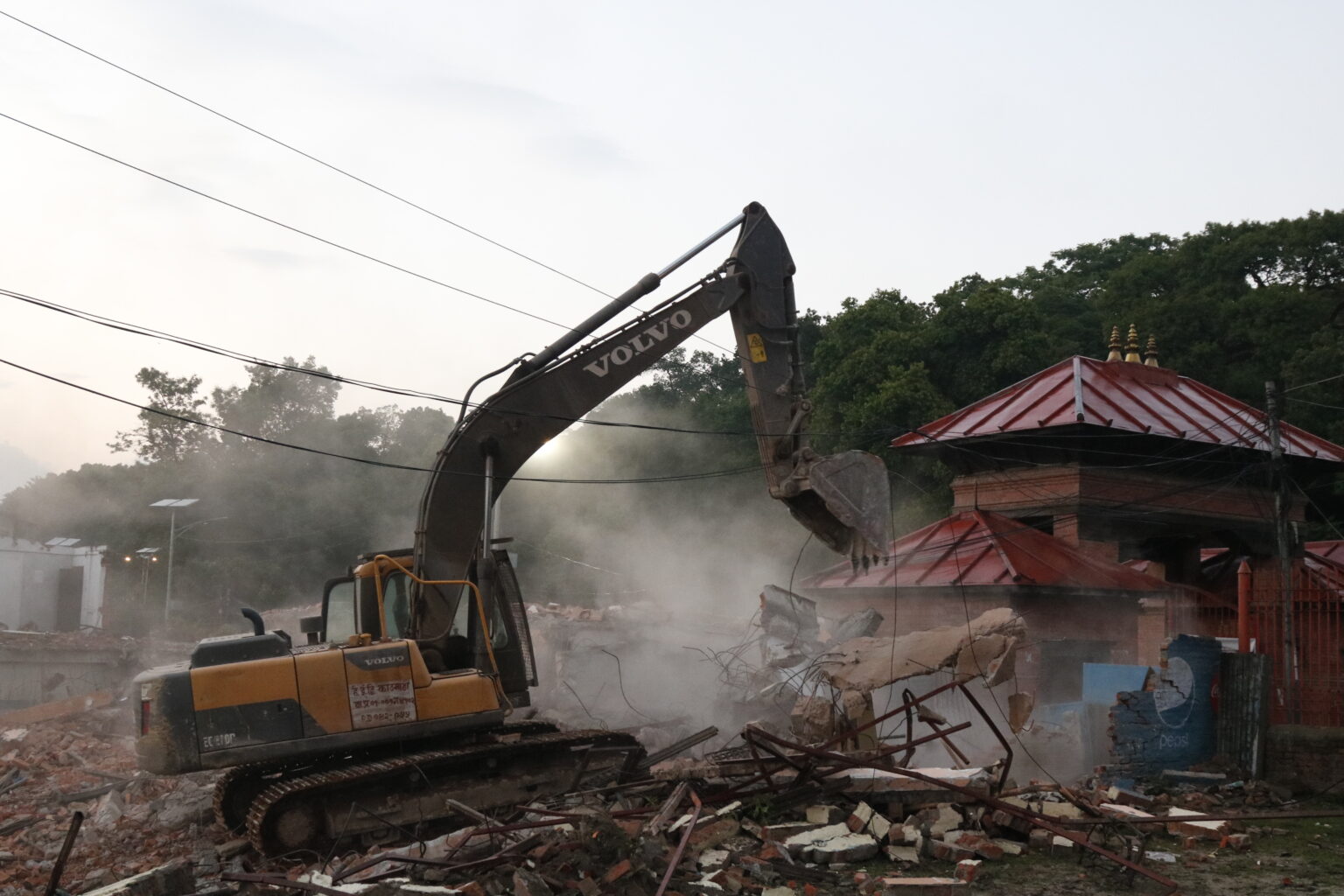 Huts built by encroaching upon land being demolished at Tilganga Pashupati Area