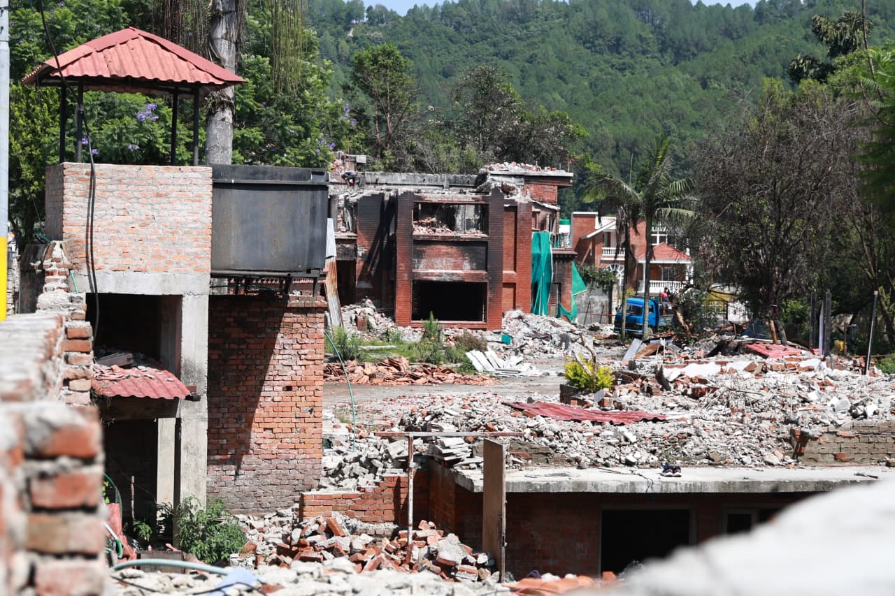 Ruins of Deuba residence stand with CIAA notice [Photo feature]