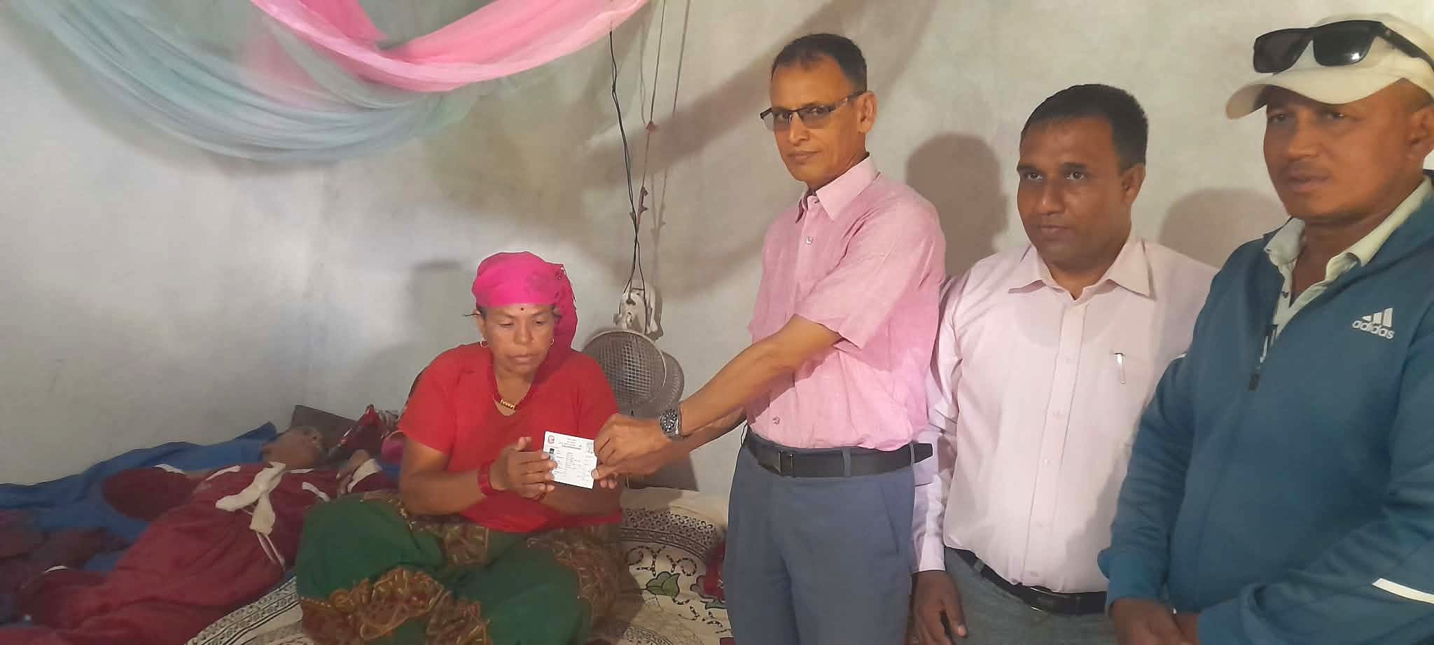 Bedridden woman receives citizenship certificate at home in Parbat