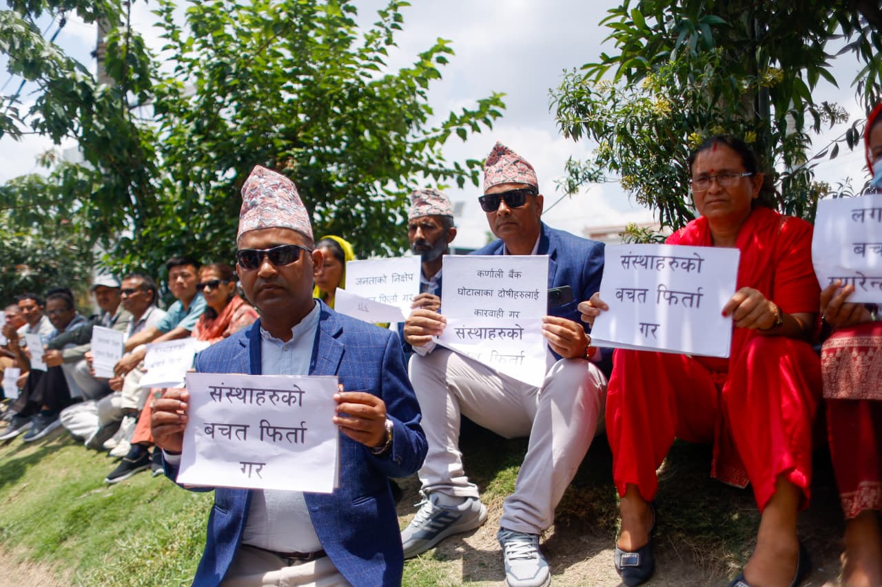 Victims of Karnali Development Bank protest at Maitighar seeking refund of savings [Photo Feature]