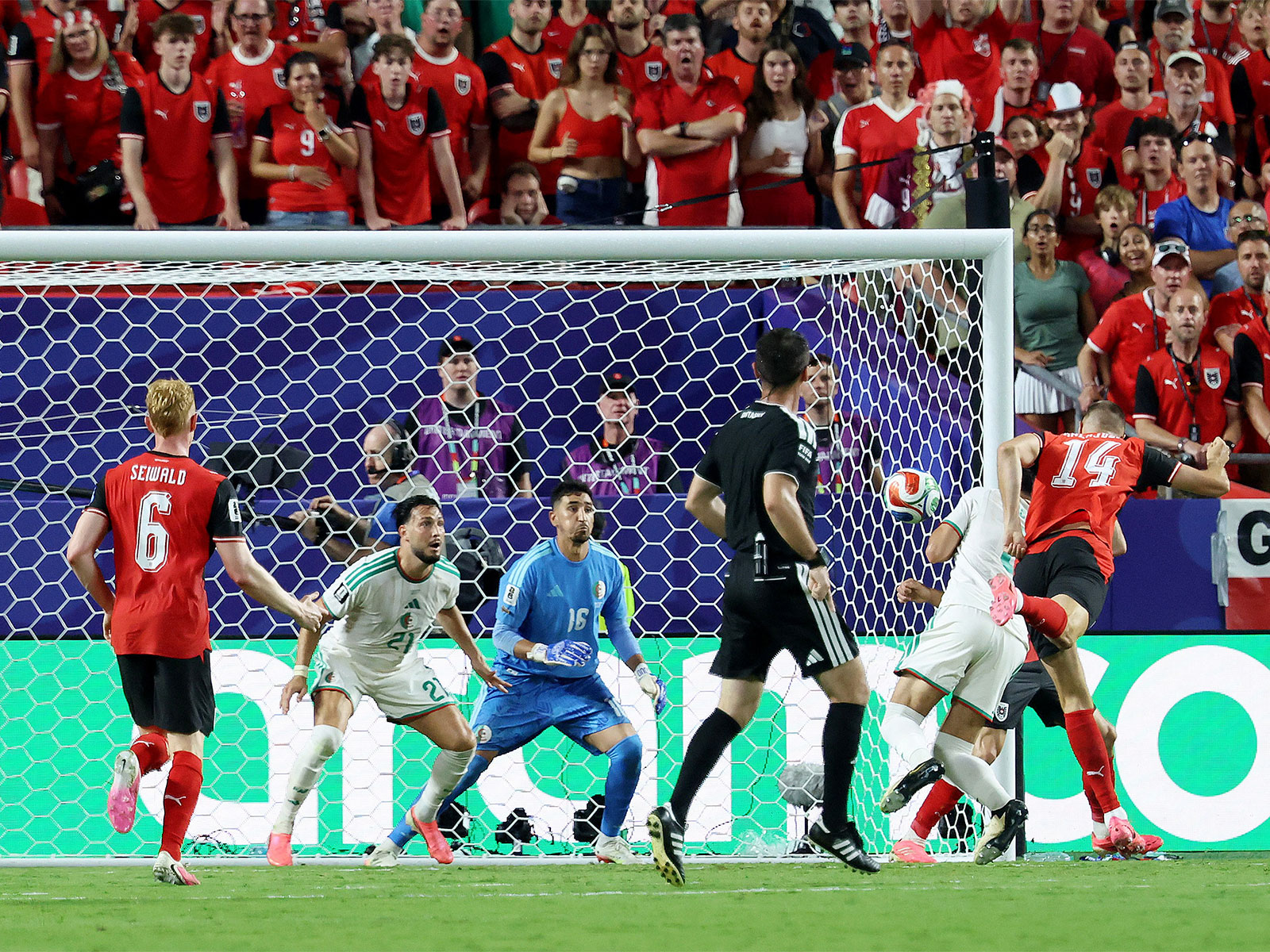 Last-gasp Austria break Iran hearts as six-goal thrilling tie with Algeria sends both teams into knockouts