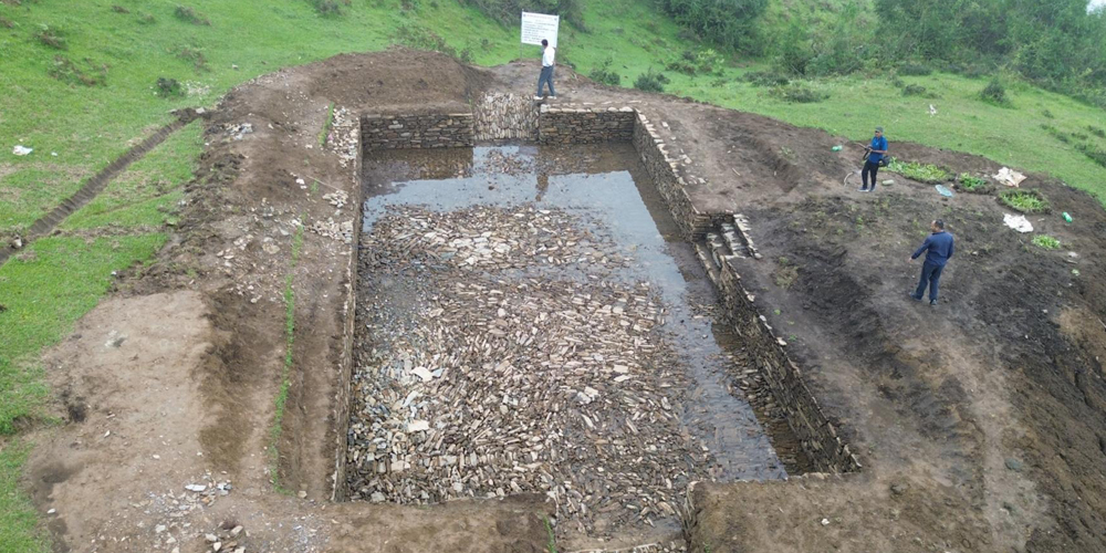 Pond constructed in community forest for wildlife